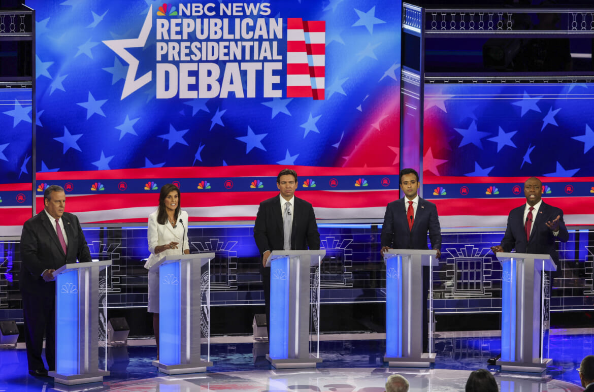 Former South Carolina Governor Nikki Haley and U.S. Senator Tim Scott (R-SC) talk over each other on the issue of abortion as former New Jersey Governor Chris Christie, Florida Governor Ron DeSantis and former biotech executive Vivek Ramaswamy listen at the third Republican candidates' U.S. presidential debate of the 2024 U.S. presidential campaign hosted by NBC News at the Adrienne Arsht Center for the Performing Arts in Miami, Florida, U.S., November 8, 2023. REUTERS/Mike Segar