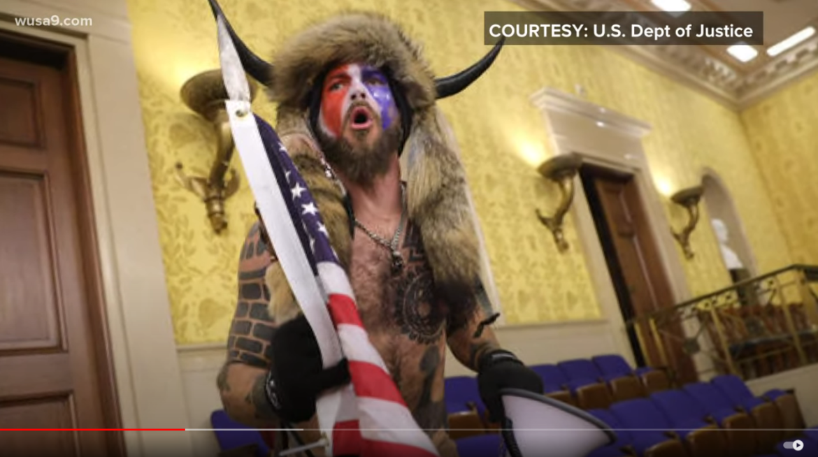 DOJ Ordered to Return "QAnon Shaman's" Confiscated Items, Spear & Horned Coyote-Tail Headdress